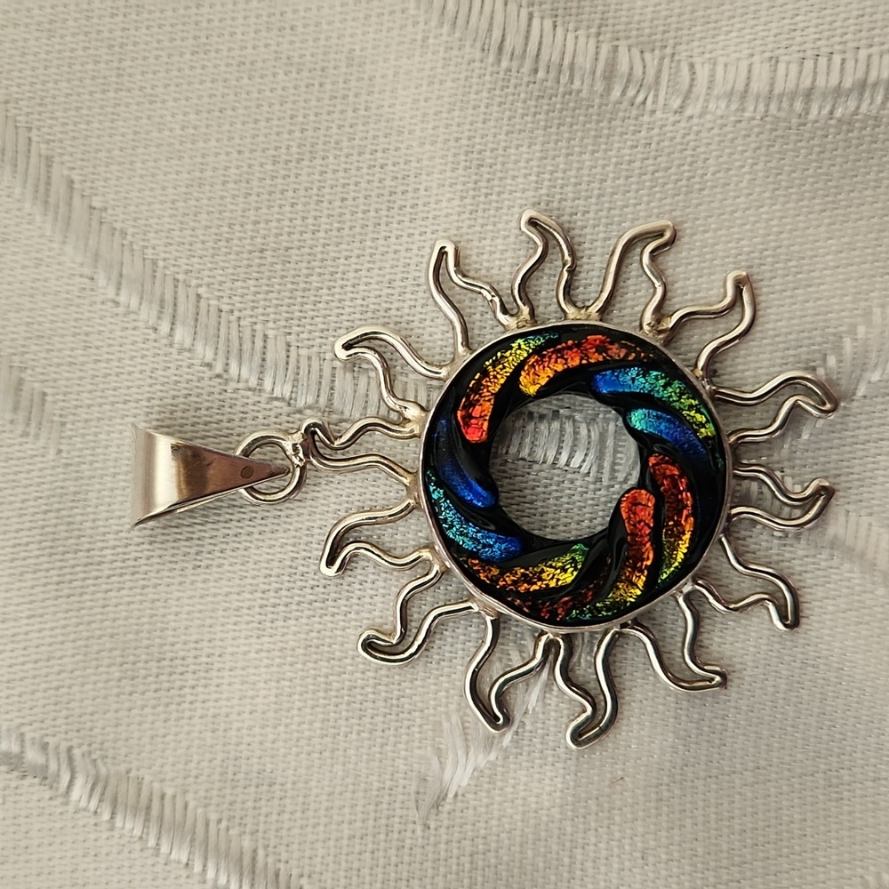 Sterling silver Sun Shaped Pendant with colorful ring in the center.